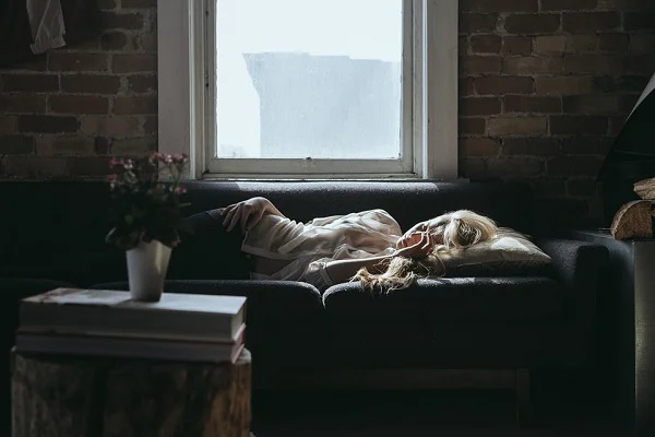 Woman sleeping on couch